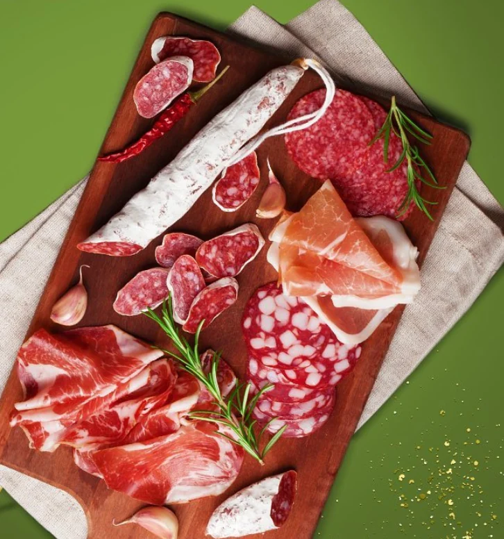 Sliced cold cuts on a serving board